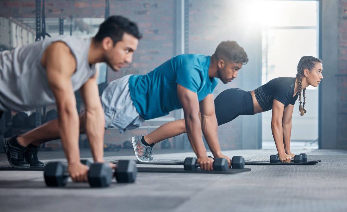 Group performing Dumbbell Only Workouts together