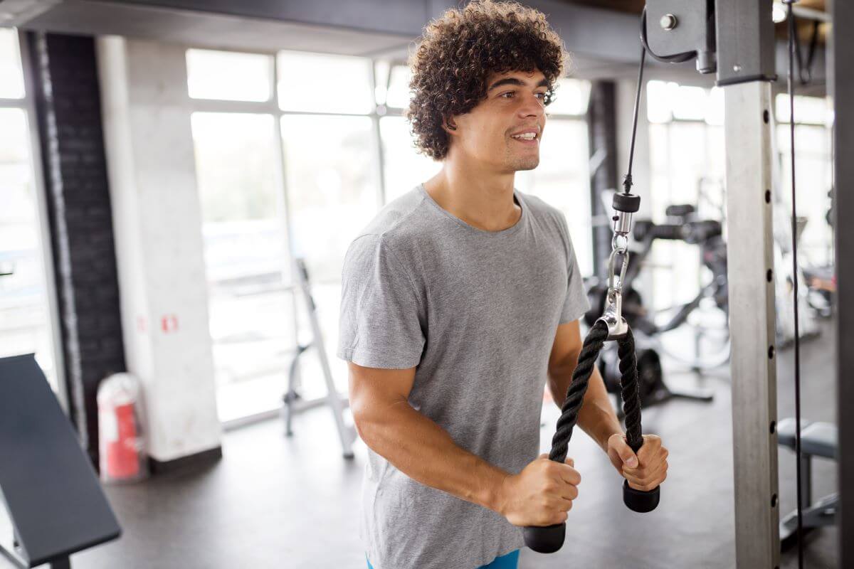 Man performing a tricep superset exercise