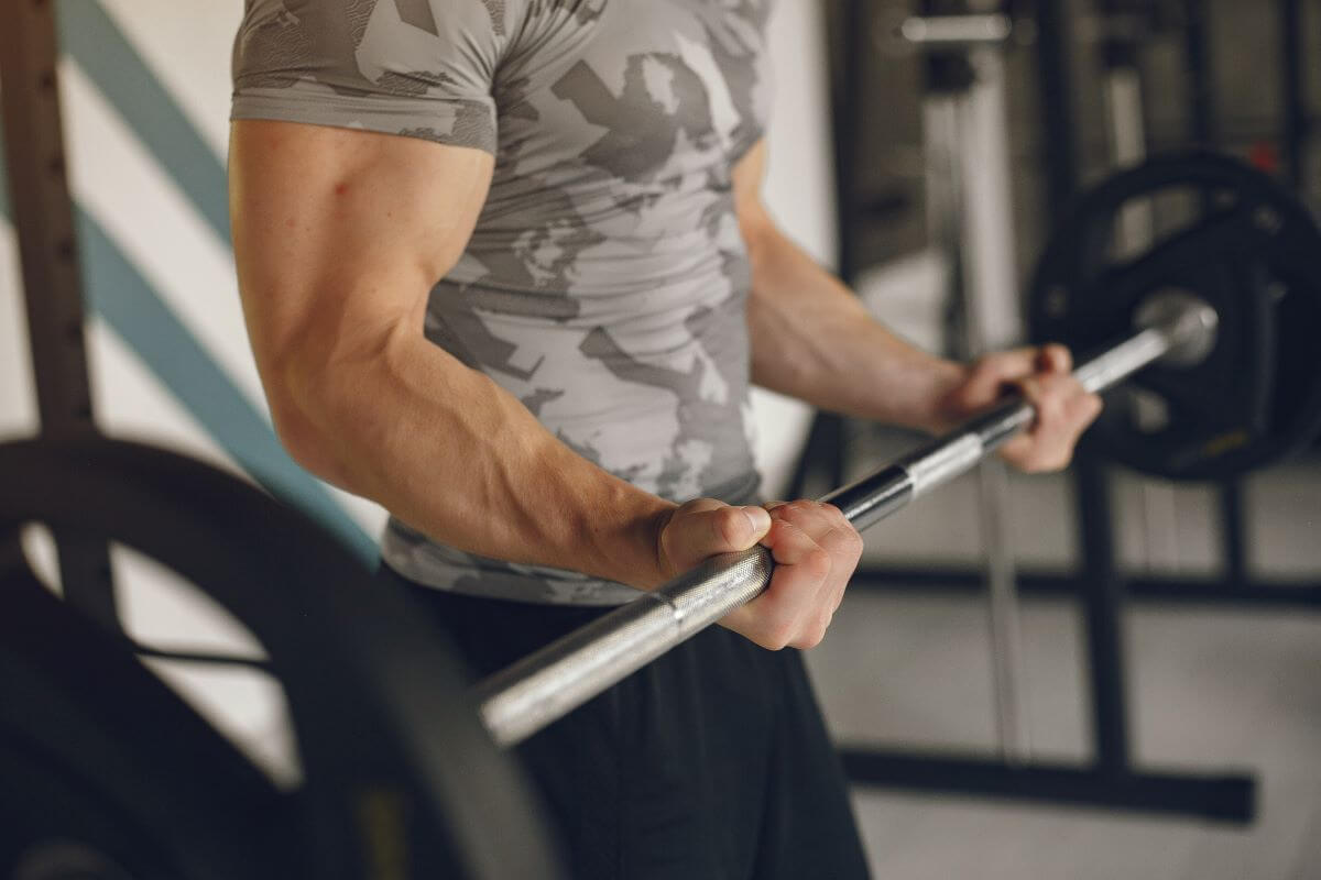 Narrow Grip Barbell Curls build the Long Head of Biceps