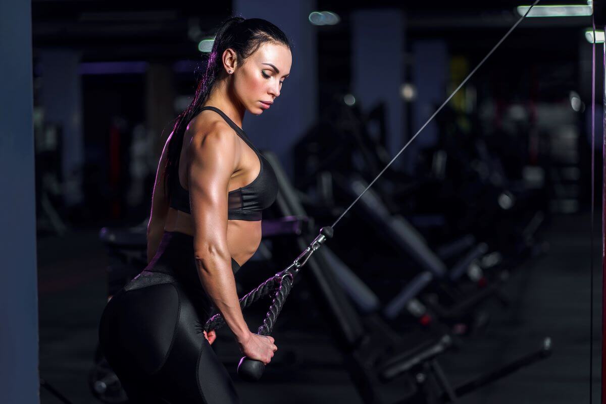 Woman performing Cable Tricep Extensions with a Rope
