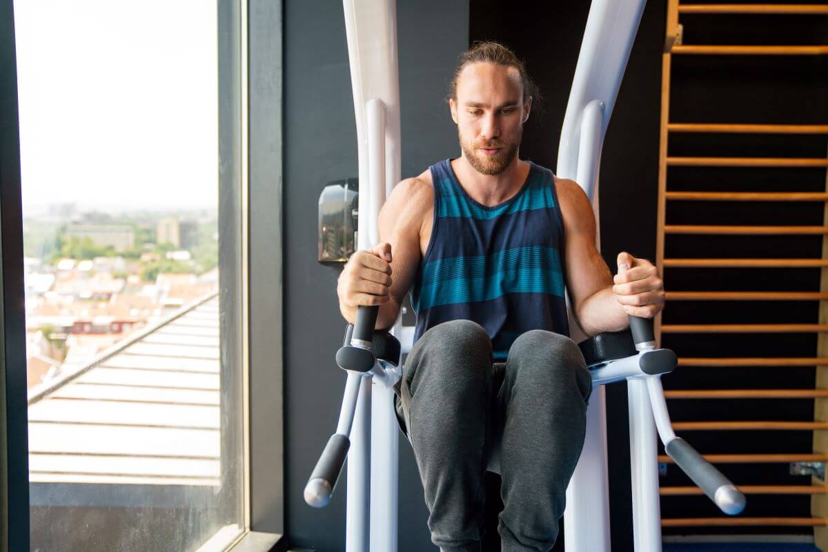 Man Performing Knee Raises during a Planet Fitness Ab Workout