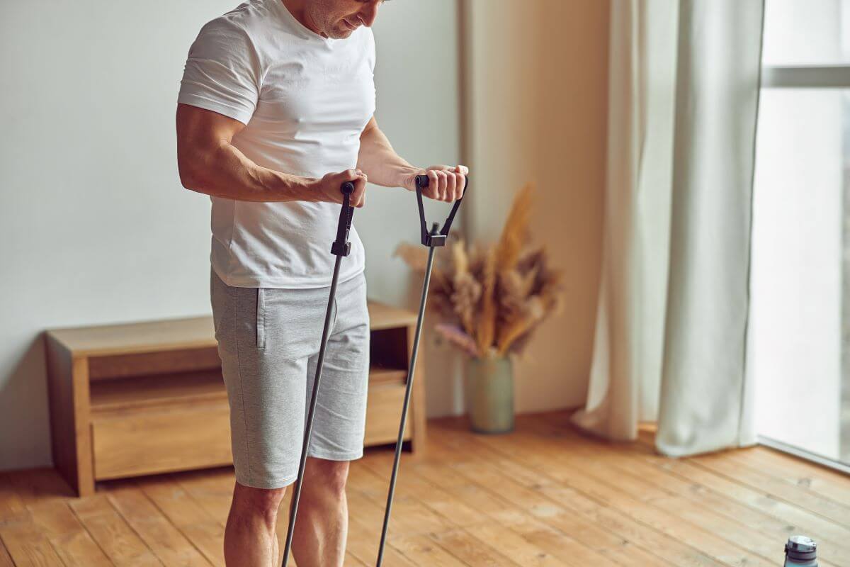 Msn Performing resistance band curls as part of 3 day resistance band workout routine