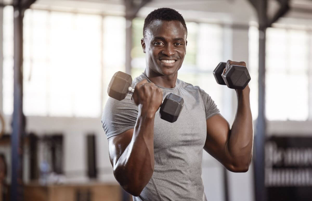 Man excited to perform his 5 day dumbbell workout routine